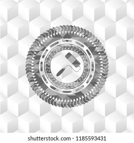 roller brush icon inside grey badge with geometric cube white background