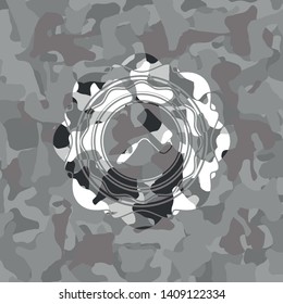roller brush icon inside grey camo emblem