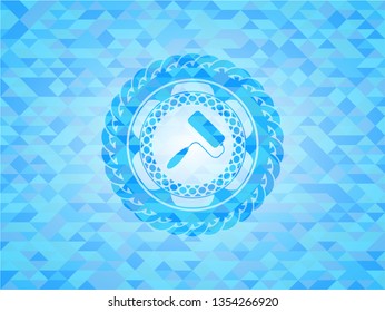 roller brush icon inside light blue emblem. Mosaic background