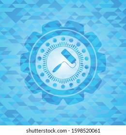 roller brush icon inside light blue emblem with triangle mosaic background