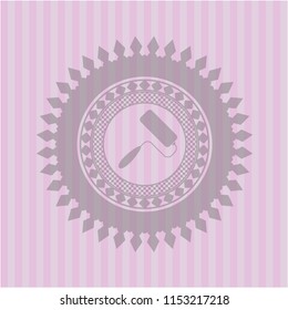 roller brush icon inside pink emblem