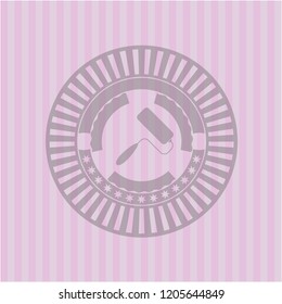 roller brush icon inside pink emblem