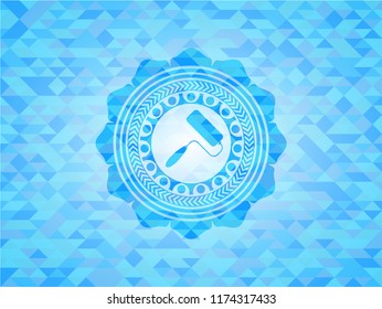 roller brush icon inside realistic light blue emblem. Mosaic background