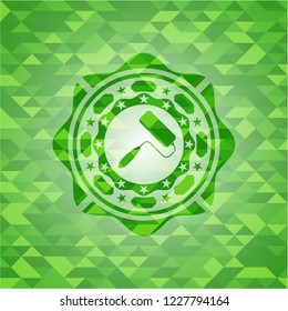 roller brush icon inside realistic green emblem. Mosaic background