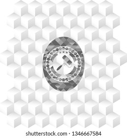 roller brush icon inside realistic grey emblem with geometric cube white background
