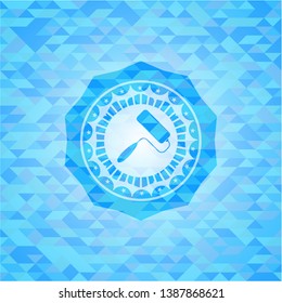 roller brush icon inside realistic light blue mosaic emblem