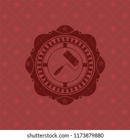 roller brush icon inside red icon or emblem