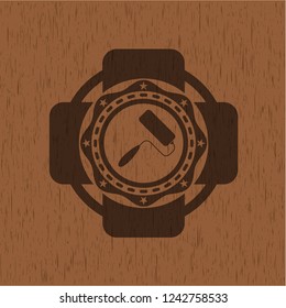 roller brush icon inside retro wooden emblem
