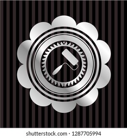 roller brush icon inside silvery badge or emblem