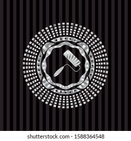roller brush icon inside silvery emblem