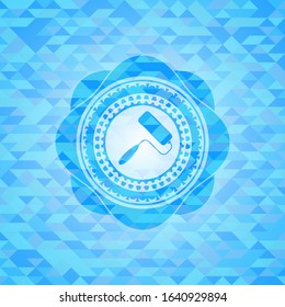 roller brush icon inside sky blue emblem with triangle mosaic background