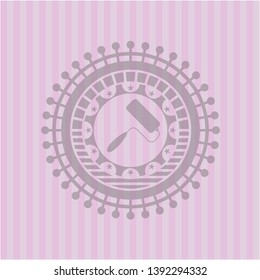 roller brush icon inside vintage pink emblem