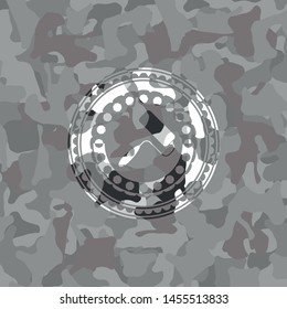 roller brush icon on grey camo texture