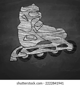 Roller skates drawn with chalk on a blackboard.
