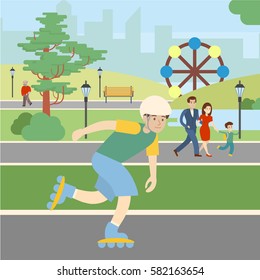 Roller skating in park. Boy in rollers and helmet has fun. Healthy lifestyle. Extreme sport.