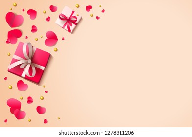 Romantic background with paper hearts and present boxes on the plain surface.