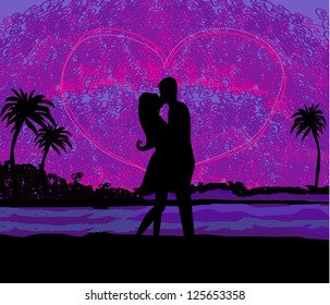  Romantic couple about to kiss on beach at sunset