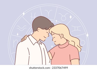 Romantic couple and horoscope wheel symbolizing full compatibility of man and woman with different zodiac signs. Hugging guy and girl believe in eastern horoscope or want to start family