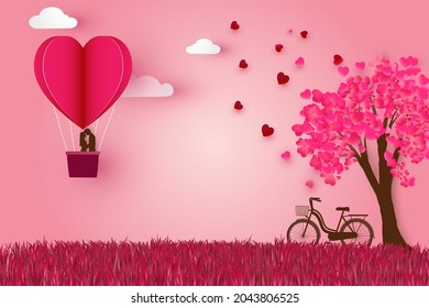 Romantic couple kissing and standing inside a basket air balloon. Heart tree and bicycle paper cut style vector illustration valentine's day concept.