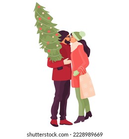 Romantic couple kissing in winter clothes, man holding a Christmas tree, woman holding a shopping bag.