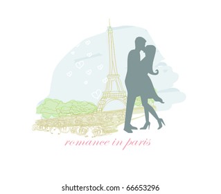 Romantic couple in Paris kissing near the Eiffel Tower.  Silhouette