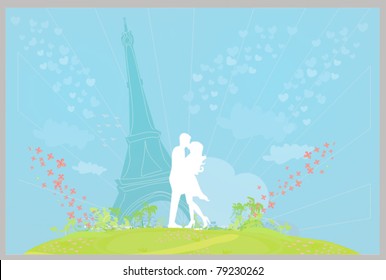 Romantic couple in Paris kissing near the Eiffel Tower. Silhouette