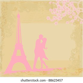 Romantic couple in Paris kissing near the Eiffel Tower. Retro card.