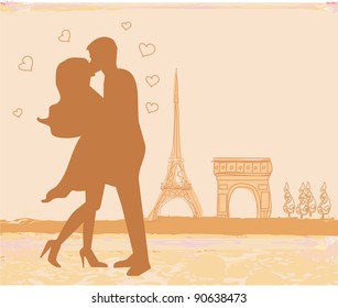 Romantic couple in Paris kissing near the Eiffel Tower. Retro card.