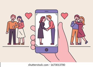 Romantic couples are taking pictures with their mobile phones. Couple picture in phone screen. flat design style minimal vector illustration.