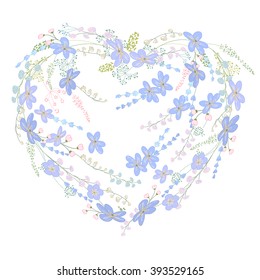 Romantic heart made of blue spring flowers.