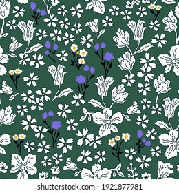 Romantic liberty print on green background. Seamless vector pattern in repeat. Vintage print with small inflorescences. Retro textile design collection.