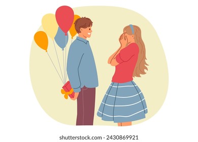 Romantic man makes birthday surprise for girlfriend, holding gift box and balloons behind back. Happy couple of girl closing eyes waiting for gift from boyfriend on relationship anniversary day