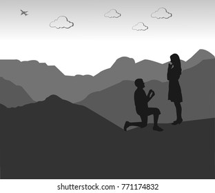 Romantic proposal on top of the mountain of a man proposing to a woman while standing on one knee silhouettes, one in the series of similar images