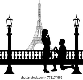 Romantic proposal in Paris in front of Eiffel tower on Valentine's day of a man proposing to a woman while standing on one knee silhouettes, one in the series of similar images