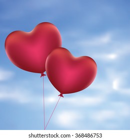 Romantic red balloons in a shape of a heart.
