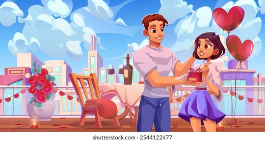 Romantic rooftop cafe setting with young couple enjoying date against city skyline. Decorated terrace with dining table, heart balloons, red roses in vase and lit candles. Man gives gift box to girl.