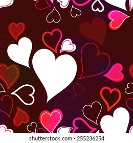 Romantic seamless background with hearts in red colors