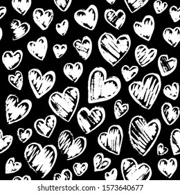 Romantic seamless pattern with cute images of hearts on a black background. Chalk drawing on a school blackboard. Expression of feelings of love and sympathy. Pattern design for valentines day. Stock 