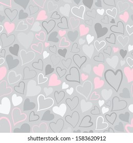 Romantic seamless pattern with cute images of hearts on a gray background. The style of children's drawing. Pattern design for valentines day. Stock vector illustration.
