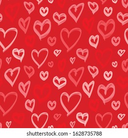 Romantic seamless pattern with hand drawn hearts. Valentines day background with red and pink heart shapes. Love theme. Doodle style illustration. Cute repeat design for decor, wallpaper, print, web