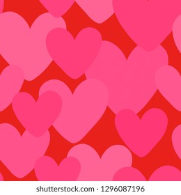 Romantic seamless pattern with hearts in pink on red background.