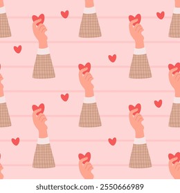 Patrón sin fisuras romántico. Corazón rojo de San Valentín en la mano sobre fondo rosa rayado. Ilustración festiva de Vector en estilo plano