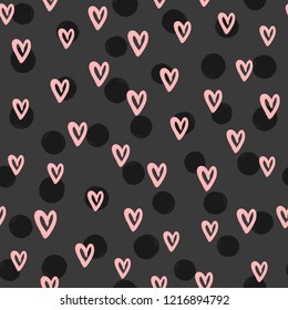 Romantic seamless pattern with round spots and hearts drawn by hand with rough brush. Sketch, watercolor, paint, ink. Cute vector illustration.
