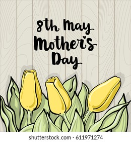 Romantic vector tulip composition with mother's day lettering, Bright yellow flowers on light wood background. Beautiful template for your design or advertise.