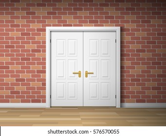 room interior with white door and brick wall