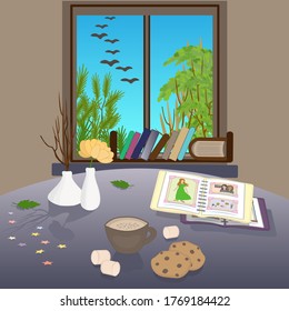 In the room table near the window. Trees outside the window. On the table is a vases, coffee, cookies and photo album. Cozy atmospher