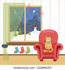 A room with a window and an armchair is decorated for Christmas. Christmas landscape outside the window, snowman. A cat wrapped in a garland sits in an armchair. Socks for gifts hang under the window
