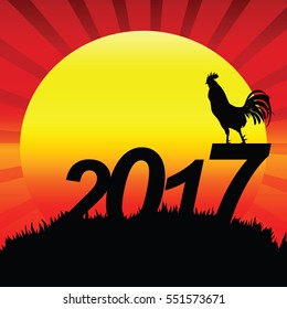 Rooster Silhouette on 2017 text for Background sunrise.