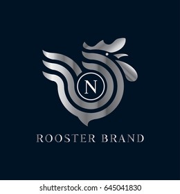 Rooster vector logo in silver gradient. Letter N domestic bird emblem