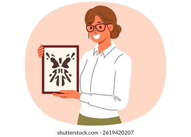 Rorschach test in hands of woman psychotherapist, want to find out psychological state patient with mental disorder. Girl psychotherapist with smile demonstrates abstract painting in form of blot.